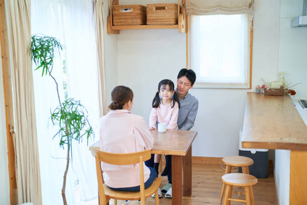 istock parents and their childr talking happily 1447696798