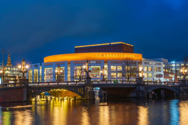 istock Amsterdam illuminated bridges at the Amstel river during winter 1447696830