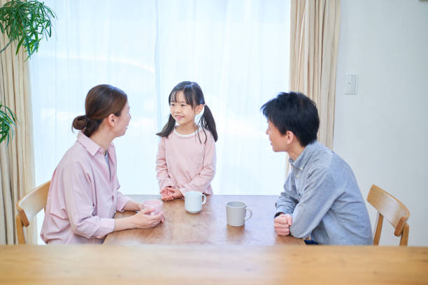 istock parents and their childr talking happily 1447697000