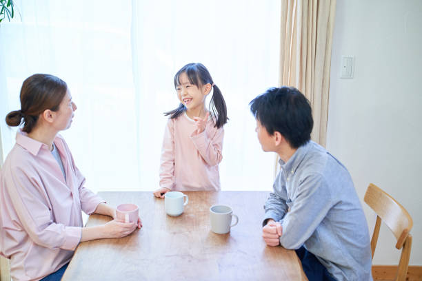 istock parents and their childr talking happily 1447697056