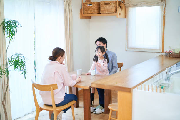 istock parents and their childr talking happily 1447697694