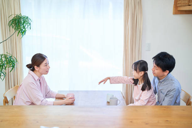 istock parents and their childr talking happily 1447697836