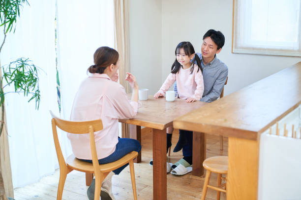 istock parents and their childr talking happily 1447697926
