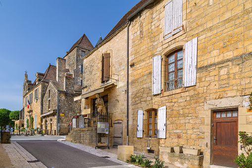Street with historical houses in Domme  commune in the Dordogne department, France