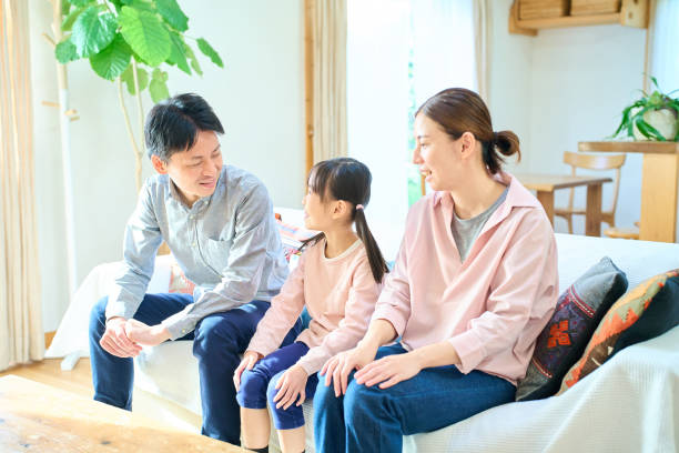 istock parents and their childr talking happily 1447698009