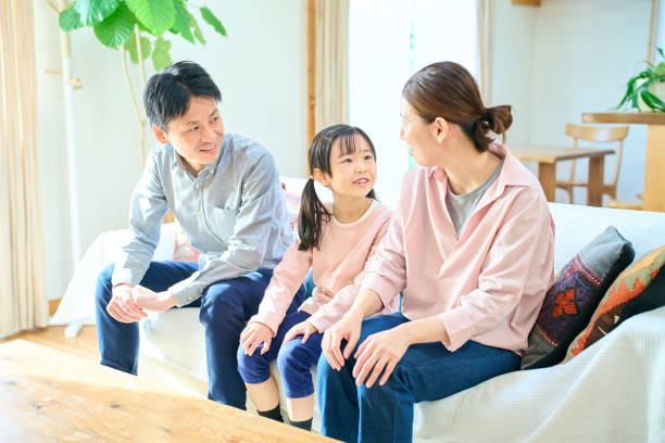 istock parents and their childr talking happily 1447698100