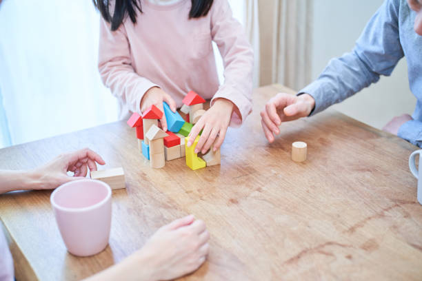 istock Parents and their child playing together 1447698603