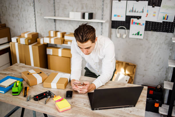 istock Young man using smarphone in online store 1447698824