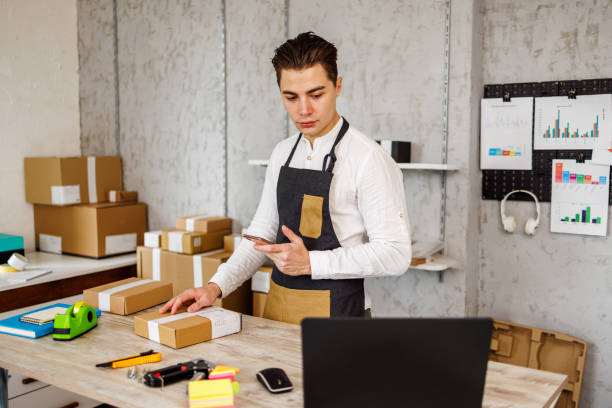 istock Online store owner prepares products for customers 1447698979