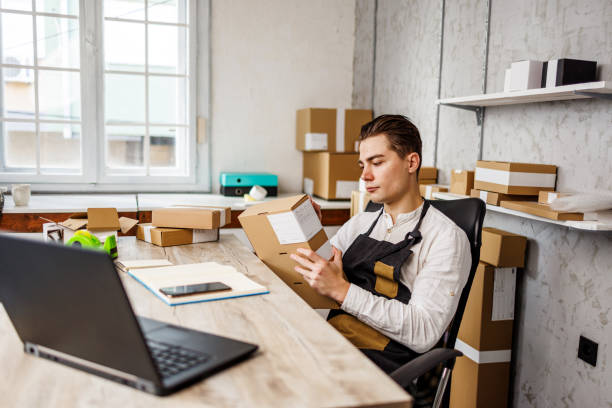 istock Man prepares products for sending 1447699682