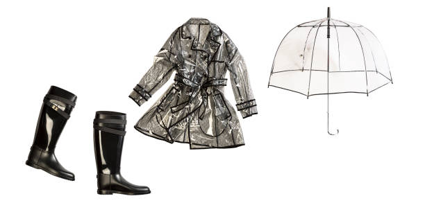 istock Fashionable black rain boot,  transparent raincoat with umbrella 1447705423