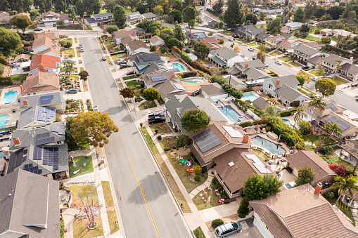 Aerial image of residential neighborhood with many solar panels