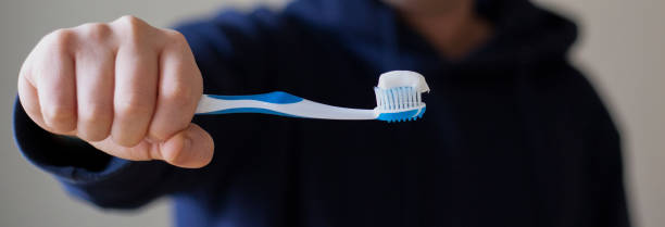 Toothbrush with toothpaste stock photo