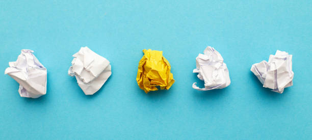 istock crumpled yelllow paper as a concept creative idea and innovation. banner 1447719787