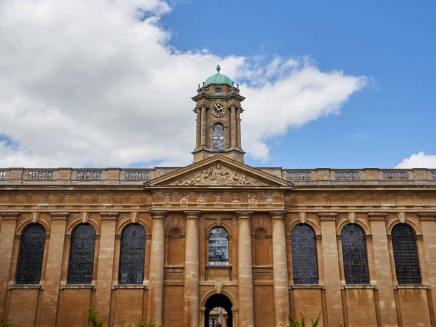 The Queen´s college, Oxford University, UK Oxford, United Kingdom - June 10, 2022: Building of The Queen´s college with a tower with a clock in the front quad. Oxford University, England, UK queens college stock pictures, royalty-free photos & images