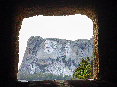 This is a classic view of Mount Rushmore as seen from one of the rock tunnels on Iron Mountain Road