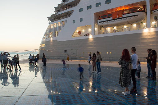 Zadar, Croatia - 30 October 2022: Cruise ship by the touristic attraction Greetings to the sun where families enjoy with their children