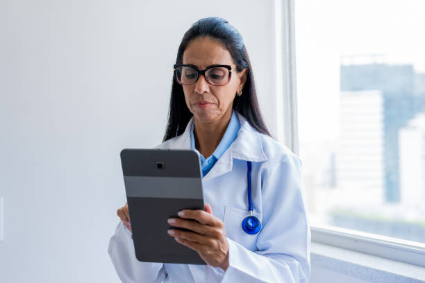 istock Portrait of female doctor using digital tablet 1447737535