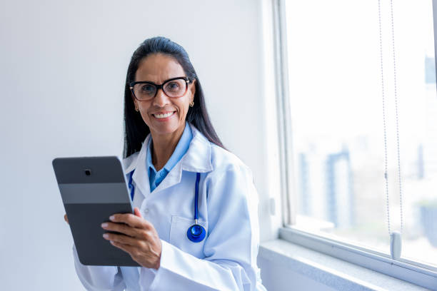 istock Portrait of female doctor using digital tablet 1447737612