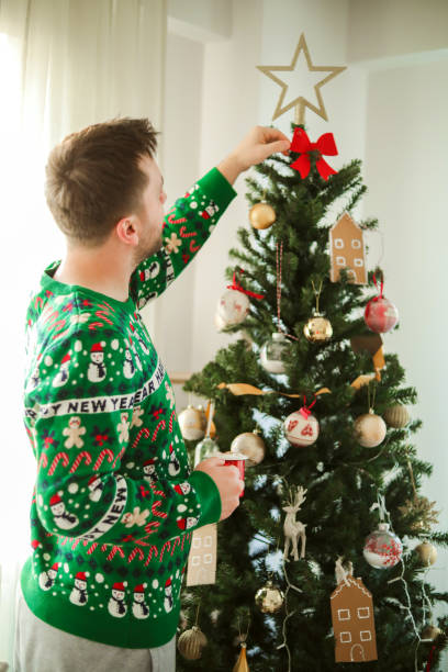 istock New Year Celebration And Christmas Tree Decoration , Men Lifestyle 1447746756