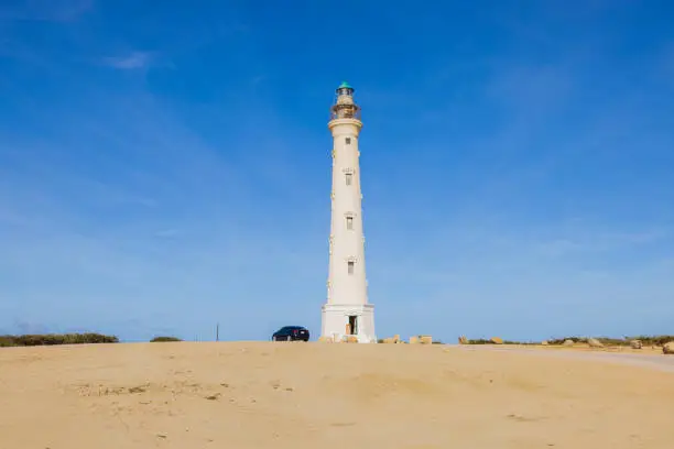 Photo of California lighthouse in desert against blue sky of southern coast of island of Aruba.