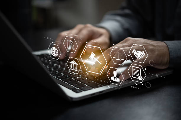 istock businessman using digital technology laptop computer law innovation Technology of Law Concept. 1447749373
