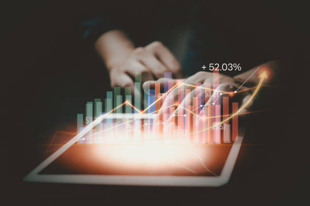 istock Businessman using tablet analyzing sales data and economic growth graph chart. Business strategy, financial and banking. Digital marketing. 1447749445