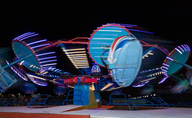 istock Carrousel in a traveling amusement park. Long exposure photography. 1447750607