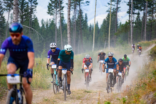 A group of men compete in the 2022 TransRockies Gravel Royale race in British Columbia, Canada. The TransRockies Gravel Royale is a four-day gravel bicycle stage race that takes the participants on a selection of gravel roads, forestry and mining roads along with some sections of singletrack trail.  Men, women and all age categories compete on the same course and take part in the mass start at the same time every day.  Gravel bicycles are similar to road bicycles but have sturdy wheels and oversized tires for riding on rough terrain.  (John Gibson Photo/Gibson Pictures)