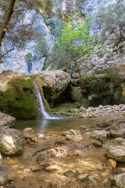 Small waterfall in the Barranc de Biniaraix on the long-distance hiking trail GR 221 Ruta de Pedra en Sec in the Tramuntana mountains on Mallorca, Spain