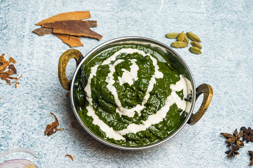 Hyderabadi Green Chicken or palak paneer, saag and palk gosht served in a dish isolated on grey background top view of bangladesh food