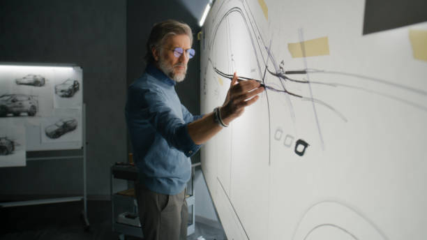 male designer creating car sketch with tools - auto ontwerper stockfoto's en -beelden