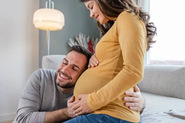 Photo of A happy couple expecting a baby