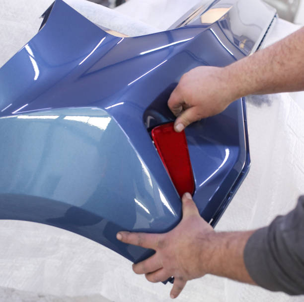 istock Man painting a car 1447762698