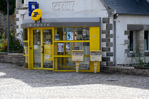 old yellow german public telephone