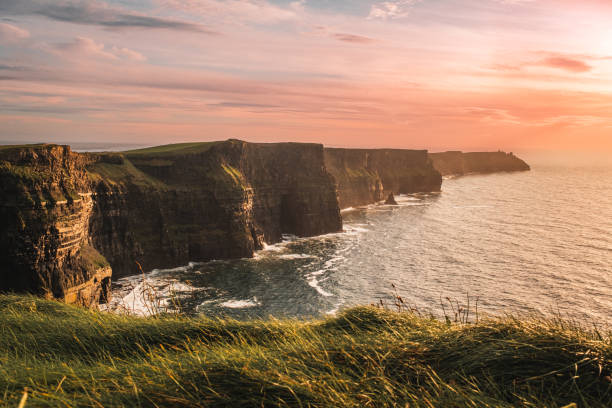 Cliffs of Moher at sunset, County Clare, Ireland Cliffs of Moher at sunset, County Clare, Ireland county galway stock pictures, royalty-free photos & images
