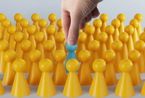 istock Yellow and blue pawns. 1447765639