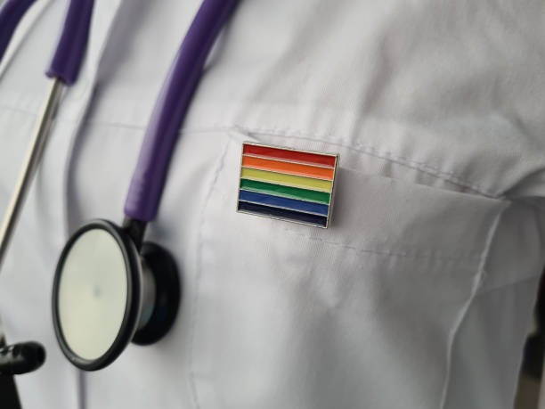 Woman doctor with lgbt flag on the pocket of clinic office Woman doctor with lgbt flag on the pocket of clinic office. Medical assistance to support LGBT community and transgender people transgender stock pictures, royalty-free photos & images