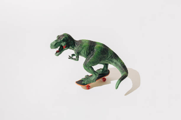 istock Tyrannosaurus rex on skateboard. White background. 1447769973