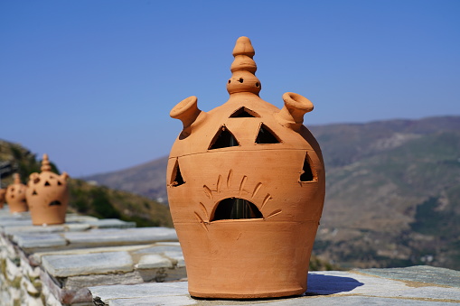 Clay lamps on the wall of the famous Panachrantou Monastery