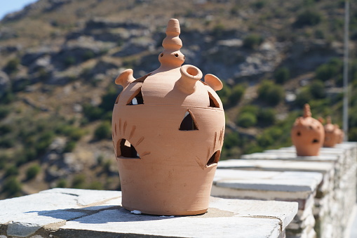 Clay lamps on the wall of the famous Panachrantou Monastery