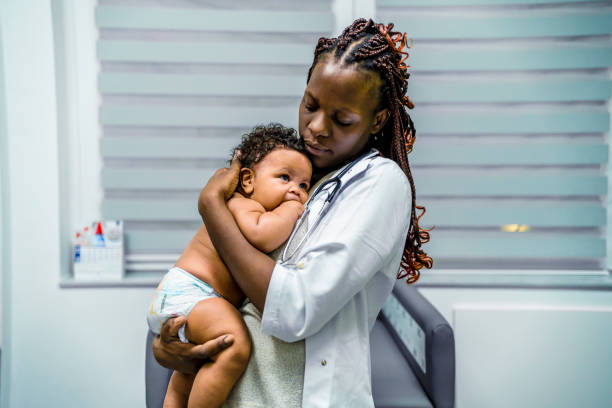 istock Cute baby boy at doctor's office 1447770854