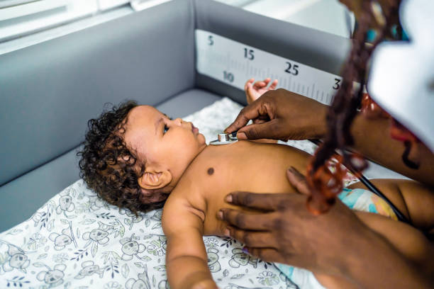 istock Pediatrician examining baby 1447771510