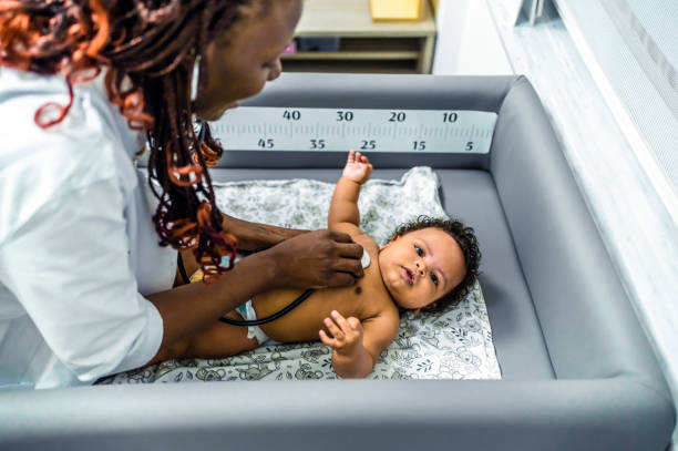 istock Pediatrician examining baby 1447771520