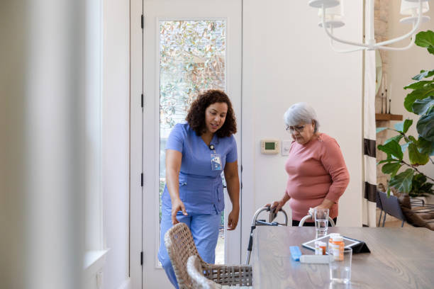 istock Nurse helps patient to the table 1447776692
