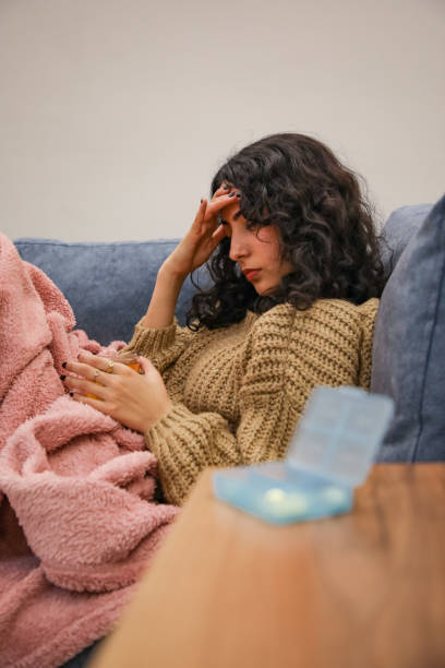 istock Young woman with headache 1447778338