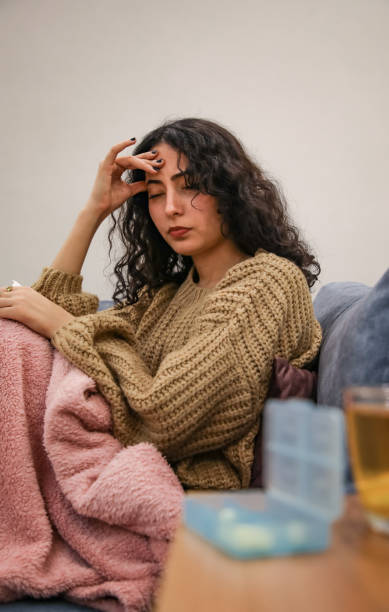 istock Young woman with headache 1447778370
