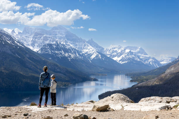 Mother and Son Hiking at Bear's Hump Trail in Waterton Lakes National Park, Alberta, Canada stock photo