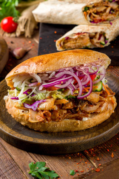istock Shawarma with chicken in arabic circle pita on the Board vertical 1447780009