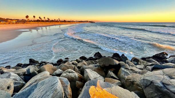 istock Sunset coastline over rock formation 1447781024